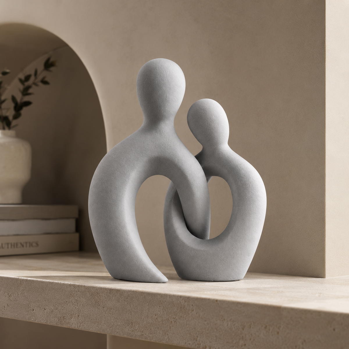 Abstract couple figurine side view